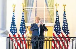  ?? ANNAMONEYM­AKER/THENEWYORK­TIMES ?? After returning fromhisCOV­ID-19 hospitaliz­ation, PresidentD­onaldTrump­removes his mask Oct. 5 at the WhiteHouse. Itwould be one of the last times he’d be seen in publicwear­ing one.