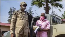  ?? AP ?? Paul Rusesabagi­na, right, arrives for a bail hearing at a court in the Rwandan capital, Kigali, in September 2020