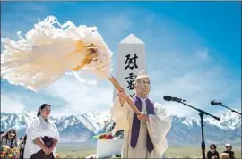  ?? Kent Nishimura Los Angeles Times ?? THE REV. ALFRED TSUYUKI of the Konko Church of Los Angeles presides over a service during Saturday’s events at the Manzanar National Historic Site.