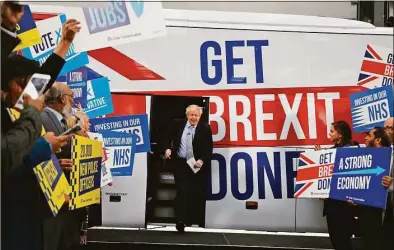  ?? Frank Augstein / Associated Press file photo ?? Britain's Prime Minister Boris Johnson addresses his supporters prior to boarding his General Election campaign trail bus in Manchester, England, on Nov. 15, 2019. The moving vans have already started arriving in Downing Street, as Britain's Conservati­ve Party prepares to evict Johnson. Debate about what mark he will leave on his party, his country and the world will linger long after he departs in September.