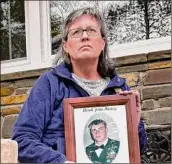  ?? Lori Van Buren / Times Union ?? Carrie Farley’s son Staff Sgt. Derek J. Farley was killed in Afghanista­n in 2010.