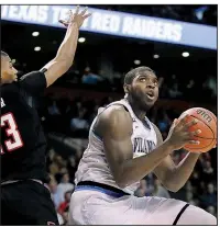  ?? AP/CHARLES KRUPA ?? Villanova’s Eric Paschall drives to the basket against Texas Tech’s Jarrett Culver during the first half of Sunday’s East Regional final of the men’s NCAA Tournament in Boston. Paschall had 12 points and a career-high 14 rebounds to help the Wildcats...