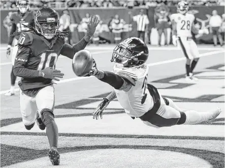  ?? Brett Coomer photos / Houston Chronicle ?? Although Steelers cornerback Joe Haden, right, breaks up a pass in the end zone intended for DeAndre Hopkins in the fourth quarter Monday, Haden was called for holding and Hopkins scored his 13th touchdown of the season later in the series.