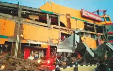  ?? AFP ?? A shopping mall was among the buildings that collapsed in Palu, central Sulawesi, after a strong earthquake and subsequent tsunami hit the Indonesian island yesterday.