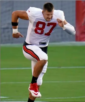  ?? AP Photo/Chris O’Meara ?? Tampa Bay Buccaneers tight end Rob Gronkowski (87) stretches his legs as he runs during an NFL football training camp practice on August 28 in Tampa, Fla.