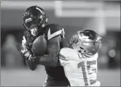  ?? ASSOCIATED PRESS ?? THIS SEPT. 23, 2017, FILE PHOTO shows Arizona State wide receiver N’Keal Harry (1) making the catch over Oregon cornerback Deommodore Lenoir during the first half of a game in Tempe. The Sun Devils got a huge boost when receiver Harry opted to return for his junior season. Big and athletic at 6-foot4, 213 pounds, Harry likely has an NFL future ahead of him, yet decided to come back to the Sun Devils.