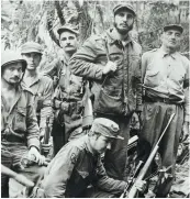  ??  ?? Fidel Castro with his command staff in a secret jungle hideout, c.1958