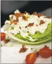  ?? STAFF ARCHIVES ?? The Wedge Salad — iceberg lettuce, cherry tomato, bacon and crumbled blue cheese — is defined by the blue cheese dressing