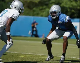  ?? DETROIT LIONS VIA AP ?? Detroit Lions cornerback Jeff Okudah, right, works out during NFL training camp last year in Detroit.