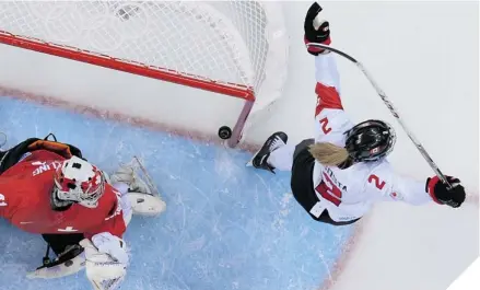  ?? JONATHAN NACKSTRAND/AFP/GETTY IMAGES ?? GOAL REACHED Canada’s Meghan Agosta-Marciano celebrates Natalie Spooner’s goal against Switzerlan­d in Monday’s semifinal.