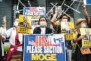  ?? Photograph: Philip Fong/AFP/Getty Images ?? A group of Myanmar activists demonstrat­e with placards calling the US government to sanction Myanmar’s state-run Myanma Oil and Gas Enterprise ahead of Joe Biden’s visit to Japan on 22 May 2022.