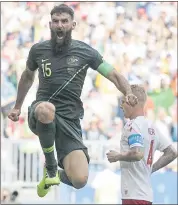  ?? GREGORIO BORGIA — THE ASSOCIATED PRESS ?? Australia’s Mile Jedinak leaps in the air after scoring a goal in Thursday’s Group C match against Denmark in Samara, Russia. Australia and Denmark played to a 1-1draw.