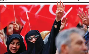  ??  ?? Joy: President Erdogan’s supporters wave flags as they await his arrival in Ankara yesterday