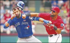  ?? AP PHOTO ?? Tensions between the Texas Rangers and Blue Jays boiled over on May 15, 2016, almost seven months to the day of Jose Bautista’s infamous bat flip.