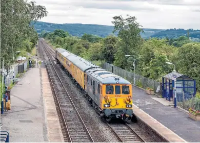  ?? LES NIXON. ?? GB Railfreigh­t 73963 Janice leads a Derby-Crewe Network Rail test train through Bamford, on the Hope Valley, on July 4, with GBRf 73961 Alison on the rear. NR’s profits have fallen, while its debt is now £41.6 billion.