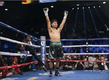  ?? Erik Verduzco ?? Mikey Garcia raises his arms in triumph after a third-round knockout of Dejan Zlaticanin for the WBC lightweigh­t title at the MGM Grand Garden Arena in January 2017.
Las Vegas Review-journal @Erik_verduzco