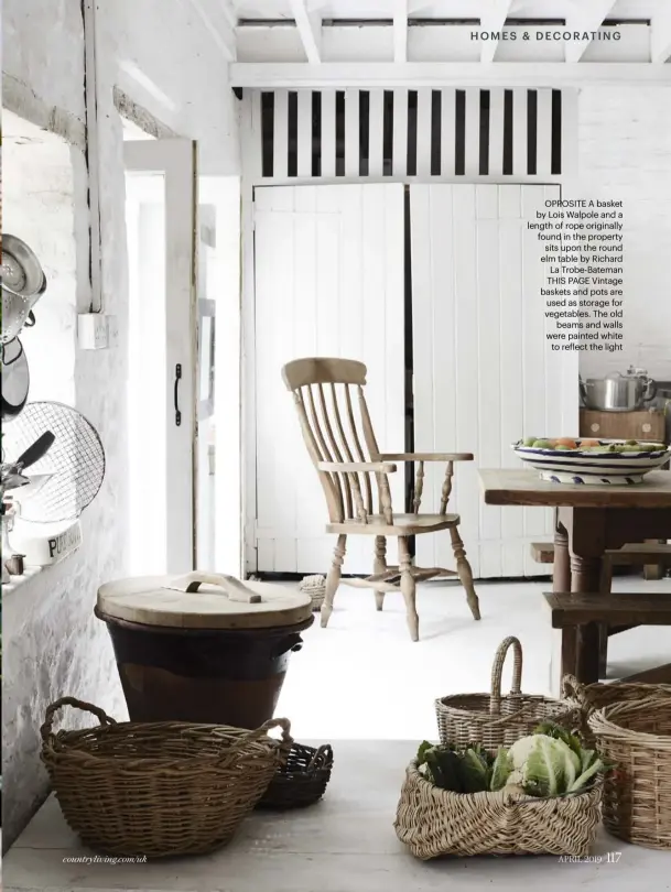  ??  ?? OPPOSITE A basket by Lois Walpole and a length of rope originally found in the property sits upon the round elm table by Richard La Trobe-bateman THIS PAGE Vintage baskets and pots are used as storage for vegetables. The old beams and walls were painted white to reflect the light