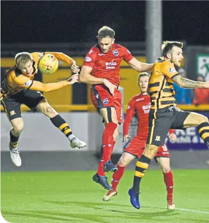  ??  ?? Keith Watson scores the winner as Ross County continued their promotion bid with a win