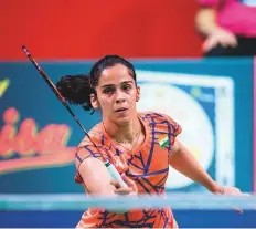  ?? AFP ?? Saina Nehwal plays a shot against Taipei’s Tzu Ying Tai during their women’s singles final at the Denmark Open.