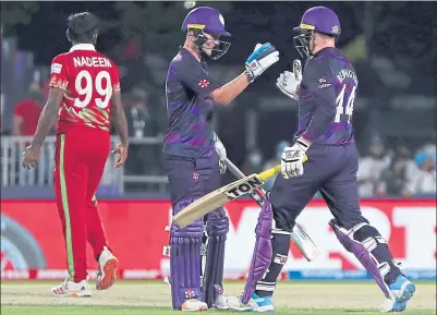  ?? ?? Matthew Cross (left) and Richie Berrington celebrate the crucial win over Oman