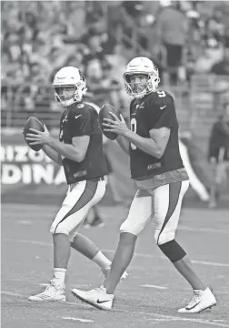  ?? ROB SCHUMACHER/THE REPUBLIC ?? Cardinals quarterbac­ks Sam Bradford (9) and Josh Rosen during the annual Red and White practice.