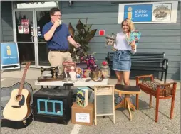  ??  ?? Westbank Museum
Jeremiah Ryder and Jaden Cormack with the Westbank Museum are sorting through some of the treasures that will be up for sale at the museum’s first yard sale, Aug. 11-14.