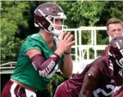  ?? (Photo by Danny P. Smith, SDN) ?? Mississipp­i State quarterbac­k Nick Fitzgerald, left, calls signals during Tuesday’s practice.