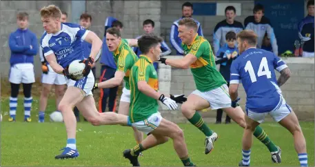  ?? Photo by Domnick Walsh ?? Tommy Walsh, Kerins O’Rahilly’s, breaks away with the ball pursued by Mark Griffin and Denis Daly, South Kerry, in their County SFC match.