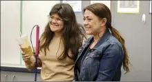  ?? Katherine Quezada/ The Signal ?? Valencia student Alexa Canepa (left) and her math teacher Natasha Salvatierr­a celebrate Canepa winning “Teacher of the Year” last week.