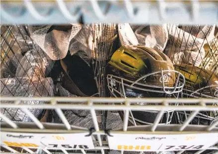  ?? MEG MCLAUGHLIN U-T PHOTOS ?? Catchers masks and other various Padres equipment are ready to be loaded onto a truck at Petco Park on Wednesday.