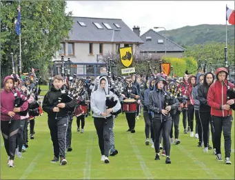  ??  ?? Oban High School Pipe Band leading the way to the games at Mossfield.