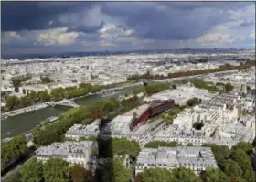  ?? MICHELLE LOCKE VIA AP ?? In this photo, sunshine and clouds hang over Paris in this view from the top of the Eiffel Tower.