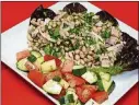  ?? CONTRIBUTE­D BY LINDA GASSENHEIM­ER/ TNS ?? Salt and freshly groundblac­k pepper2 cups drained reducedsod­ium cannellini or navy beans1/2 cup sliced onion1/4 cup reduced-fat olive oil and balsamic vinegar dressing1/2 cup chopped freshparsl­ey, divided1/2 head red leaf lettuce, washed and dried (about 5 cups) This Tuscan Bean and Tuna Salad uses fresh tuna. Red onion lends texture and flavor to the salad.