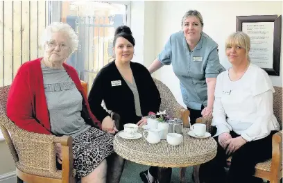  ??  ?? From left: Resident Brenda Savage, registered home manager Emma Bingham, activity co-ordinator Tracy Booth and home manager Michelle Mecer at Haslingden Hall care home