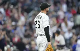  ?? David Zalubowski, The Associated Press ?? Rockies starting pitcher Austin Gomber reacts after giving up a grand slam to Atlanta’s Travis d’arnaud in the fifth inning.