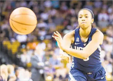  ?? Icon Sportswire / Icon Sportswire via Getty Images ?? UConn’s Megan Walker passes during a game against Central Florida in February in Orlando, Fla. Walker is expected to be a starter this season.