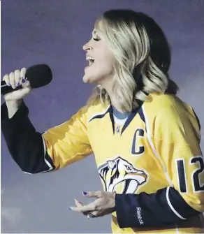  ?? THE ASSOCIATED PRESS ?? Country music star Carrie Underwood, the wife of Predators captain Mike Fisher, sang the national anthem before Game 3 of Nashville’s first-round series against the Chicago Blackhawks.