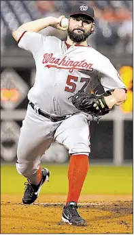  ?? AP/MATT SLOCUM ?? After Game 4 of the National League division series between the Washington Nationals and Chicago Cubs was postponed to today because of rain, Tanner Roark is expected to get the start instead of Stephen Strasburg.