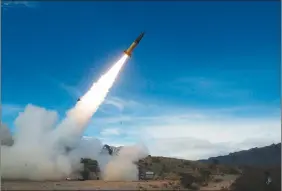  ?? U.S. officials say Ukraine for the first time has begun using long-range ballistic missiles, striking a Russian military airfield in Crimea and Russian troops in another occupied area. ?? THE ASSOCIATED PRESS