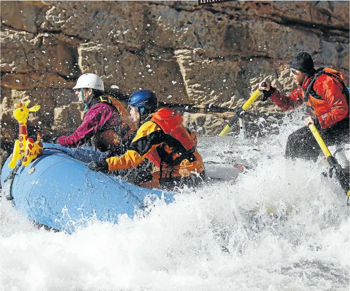  ?? Picture: Terray Sylvester/VW Pics/UIG via Getty Images ?? WILD WATERS Rafters hold on as their guide steers them through a rapid on the Colorado River in the Grand Canyon National Park.