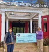  ?? Contribute­d ?? Ronald McDonald House Charities of Greater Chattanoog­a President and CEO Jane Kaylor, left, accepts the Enchanted Garden of Lights donation from See Rock City Inc. President and CEO Susan Harris.