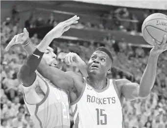  ??  ?? IN this May 4, 2018, file photo, Utah Jazz center Rudy Gobert (27) defends against Houston Rockets center Clint Capela (15).