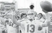  ?? MARK HUMPHREY/AP ?? UF quarterbac­k Feleipe Franks, center, celebrates a victory over Vanderbilt last season.