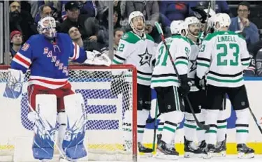  ?? AP ?? Henrik Lundqvist assesses damage as Stars celebrate goal in victory over Blueshirts at the Garden.