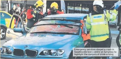  ??  ?? Emergency services staged a crash in Swadlincot­e town centre on Saturday to highlight the dangers of drink-driving