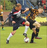  ??  ?? Keith Millar in a tussle for the ball during the game against Alloa.