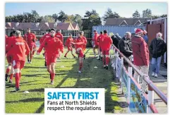  ??  ?? SAFETY FIRST Fans at North Shields respect the regulation­s