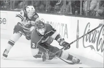  ?? Harry How Getty Images ?? KINGS DEFENSEMAN Dion Phaneuf (3) is checked tightly by the Wild’s Zach Parise in Thursday’s game.