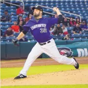  ??  ?? Isotope Derrik Gibson, top, hits against Tacoma on Monday night. Isotopes starter Harrison Musgrave allowed three runs and seven hits in 4⅓ innings on Monday.