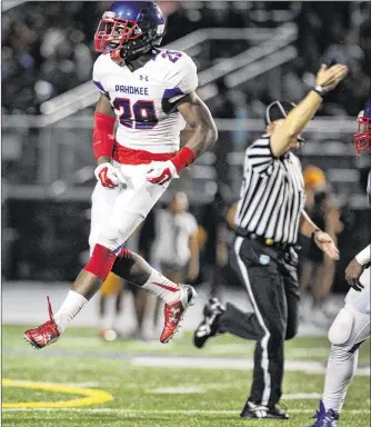  ?? RICHARD GRAULICH / THE PALM BEACH POST ?? Pahokee’s Kajuanji Boldin shows his emotions after a first-half intercepti­on against Boca Raton. Both teams’ passing games struggled on a rainy night.